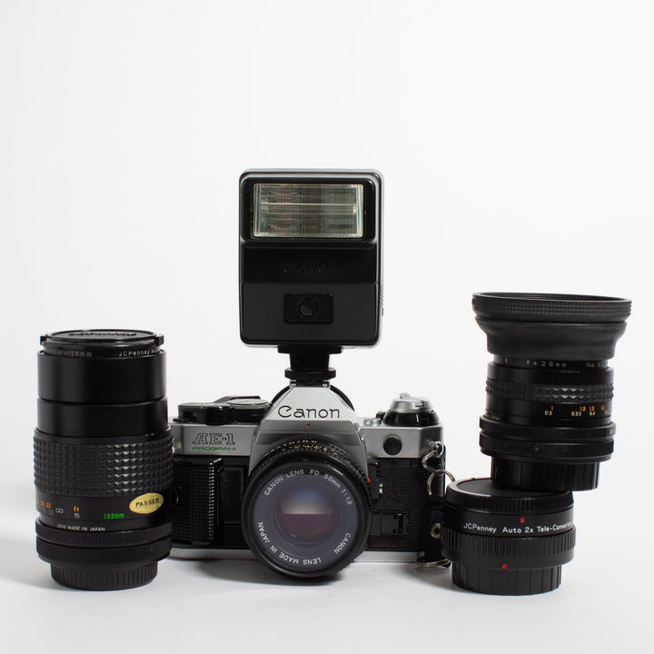 Canon AE-1 Program with 28mm, 50mm, and 135mm Lenses and Flash
