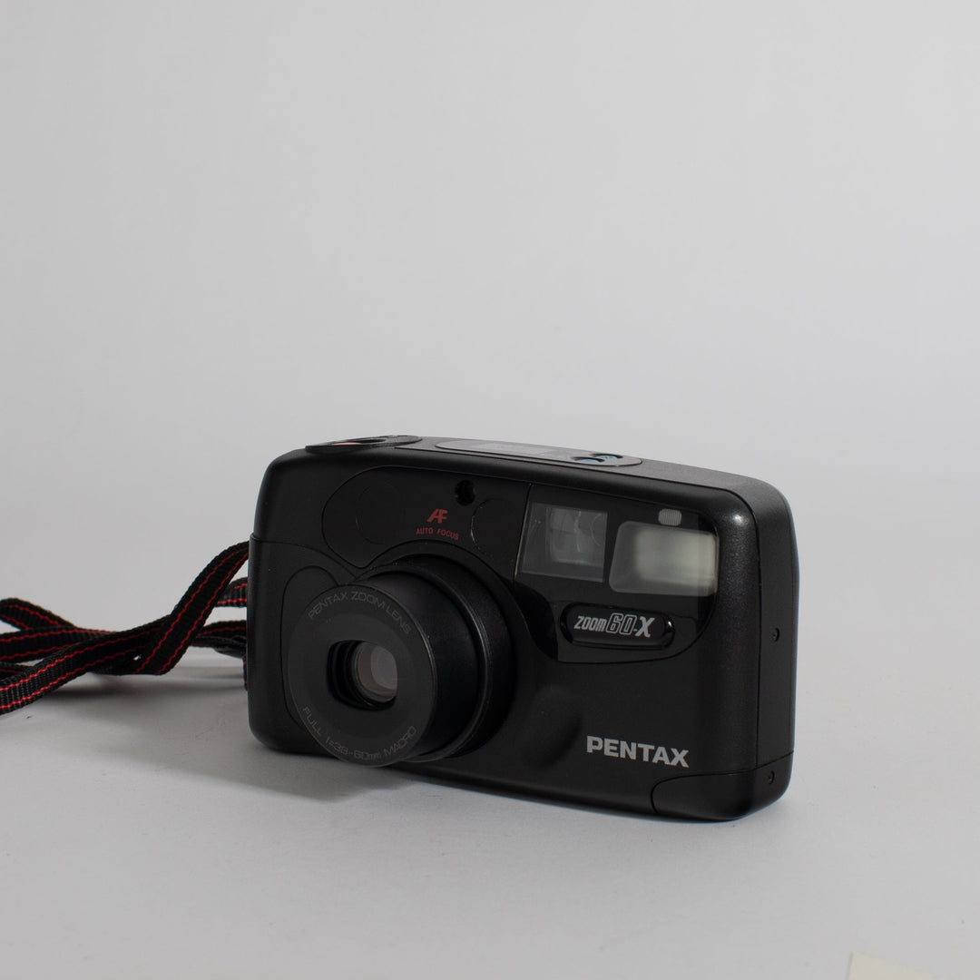 Pentax Zoom 60-X with strap