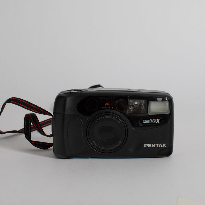 Pentax Zoom 60-X with strap