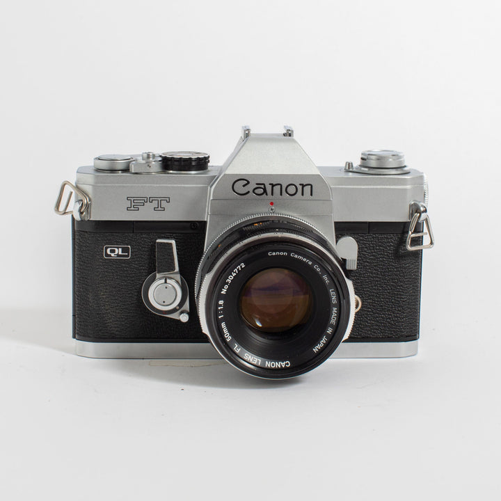 Canon FT QL w/ FL 50mm f/1.8 lens, leather casing, and strap