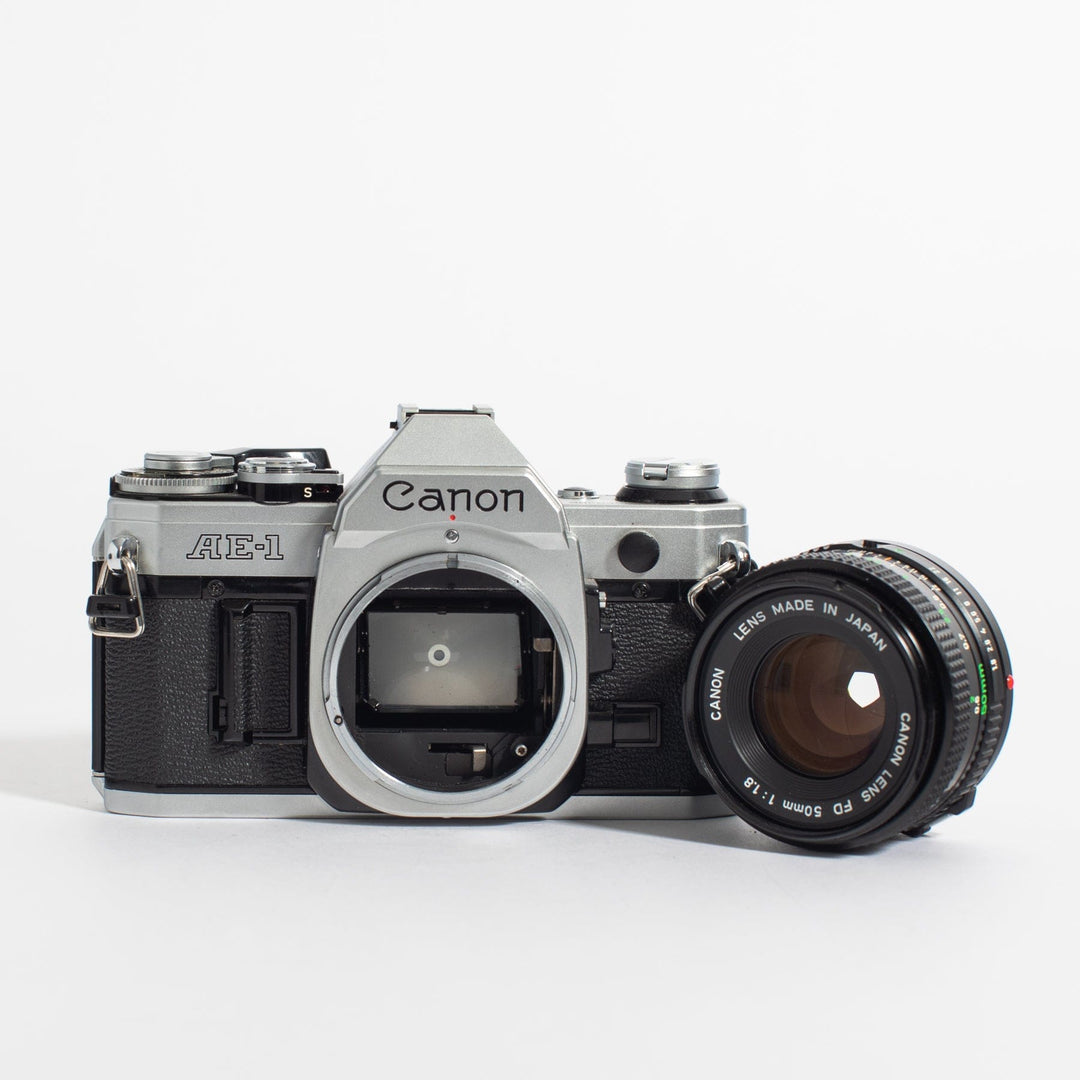 Canon AE-1 w/ 50mm FD and bonus telephoto zoom lens, body no