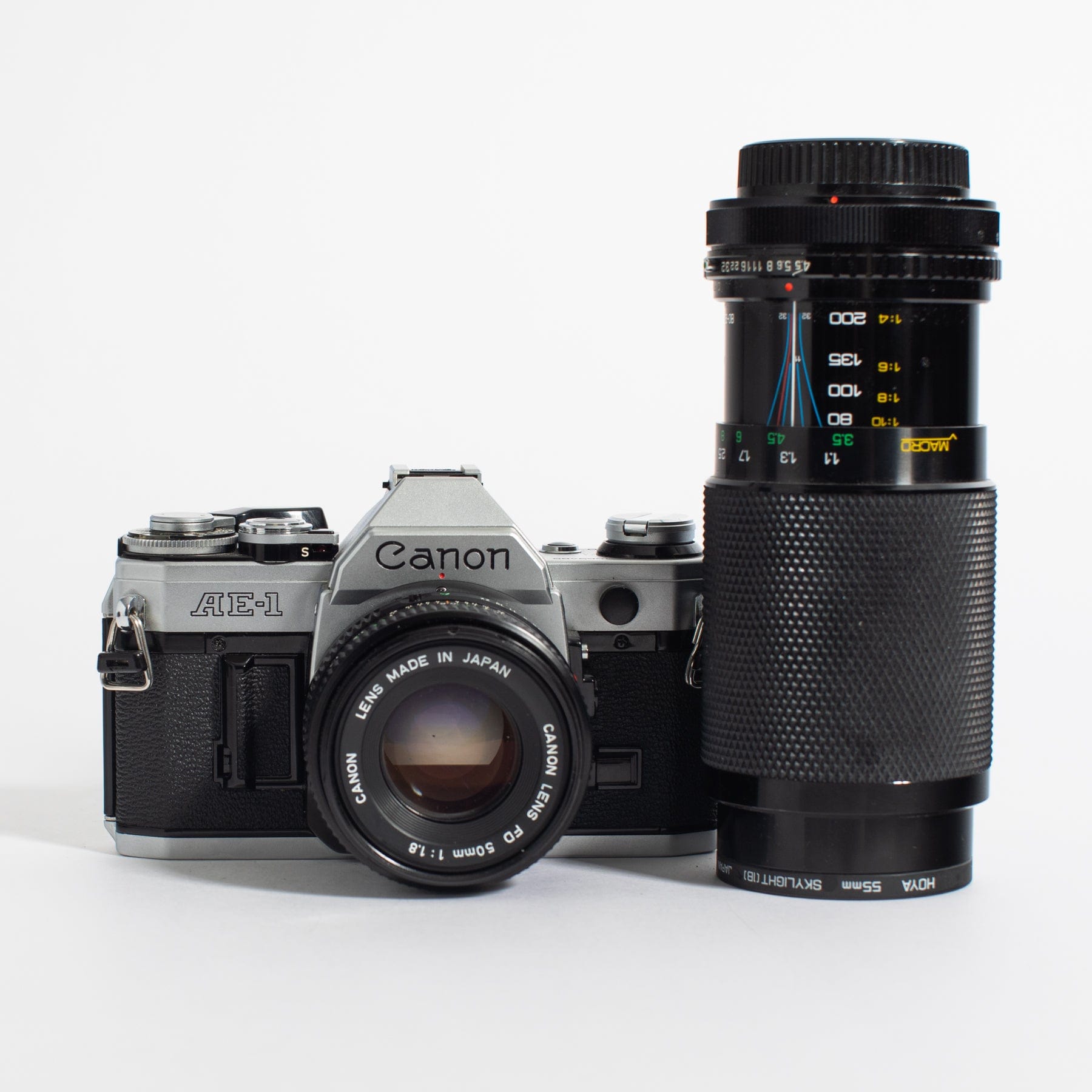 Canon AE-1 w/ 50mm FD f/1.8 and bonus telephoto zoom lens, body no 