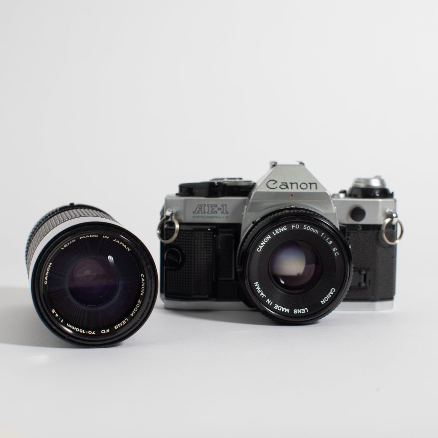 Canon AE-1 (35mm Kit) with 50mm f/1.8 and 70-150 mm lens – Film 