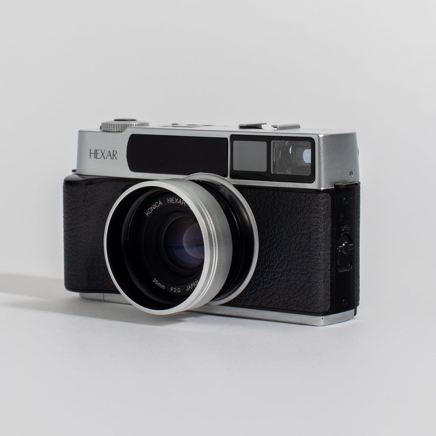 Konica Hexar Silver with 35mm f2 lens, leather case, and strap 