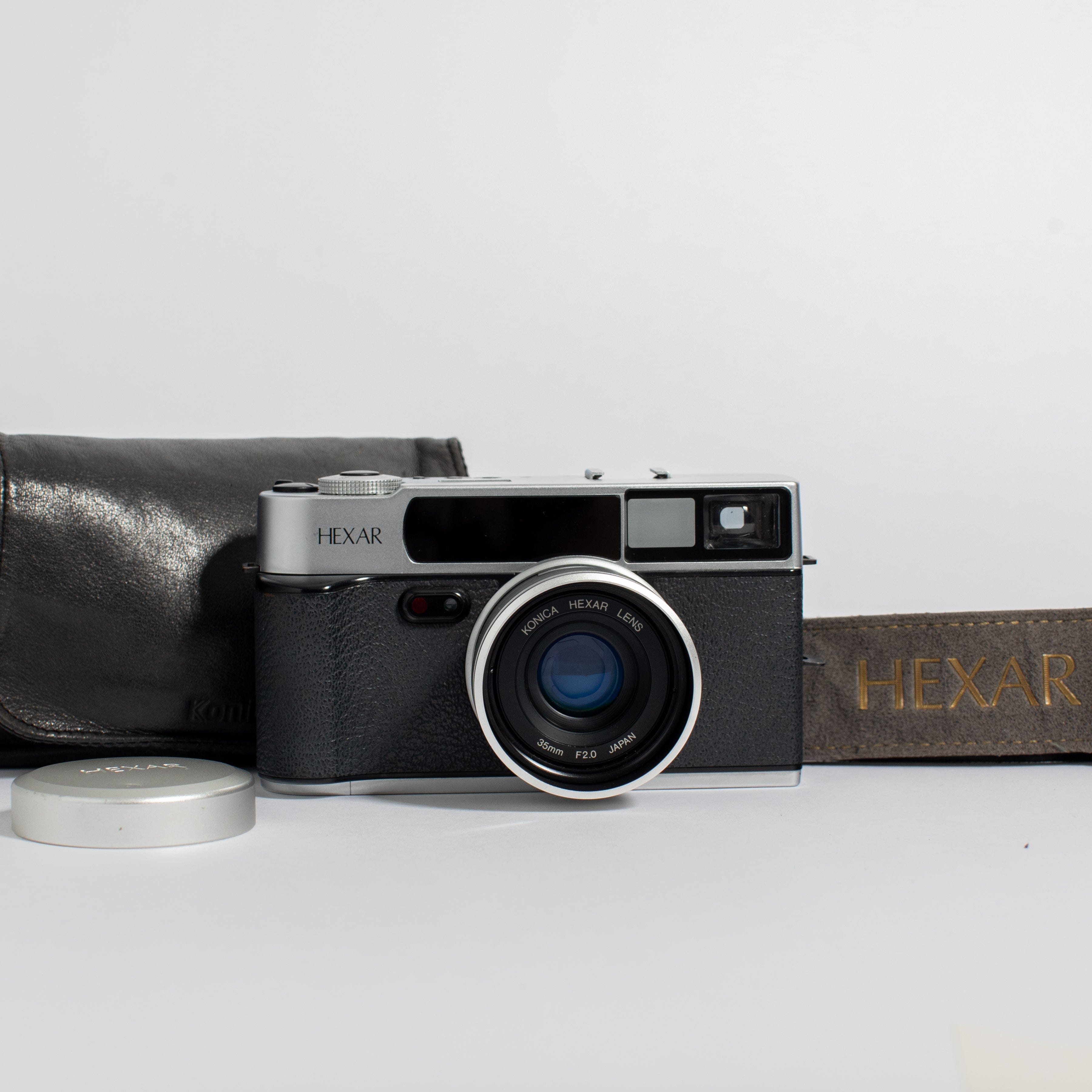 Konica Hexar Silver with 35mm f2 lens, leather case, and strap