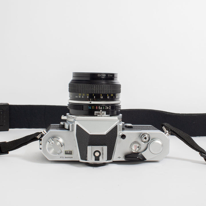 Nikkormat FT2 with Nikkor 50mm f/2 Lens and camera strap