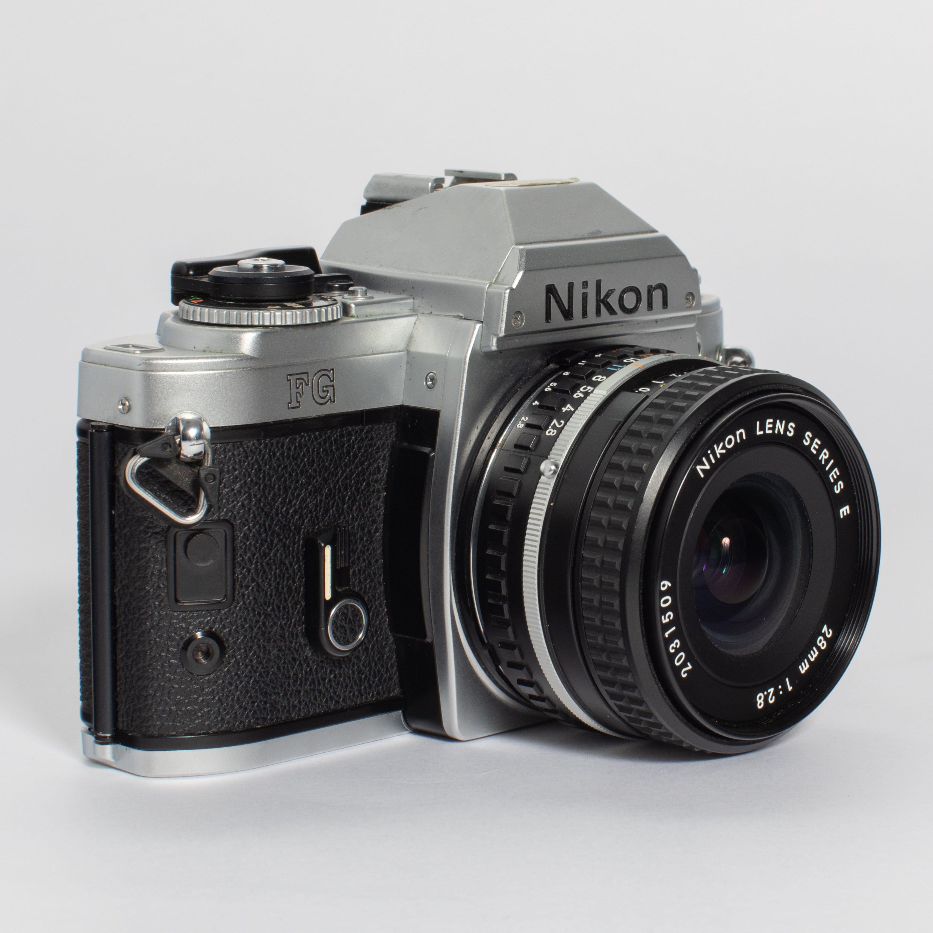 Black Nikon FG 35mm selling Film Camera with Nikon Series E 50mm f1.8